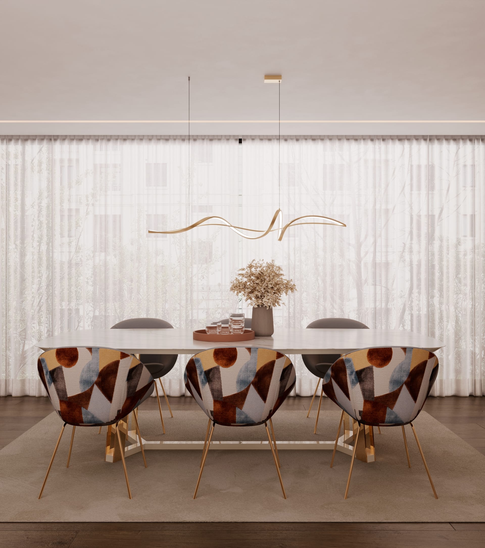 Dining room with a pale oval table, chairs upholstered in a geometric pattern and a wavy gold pendant light