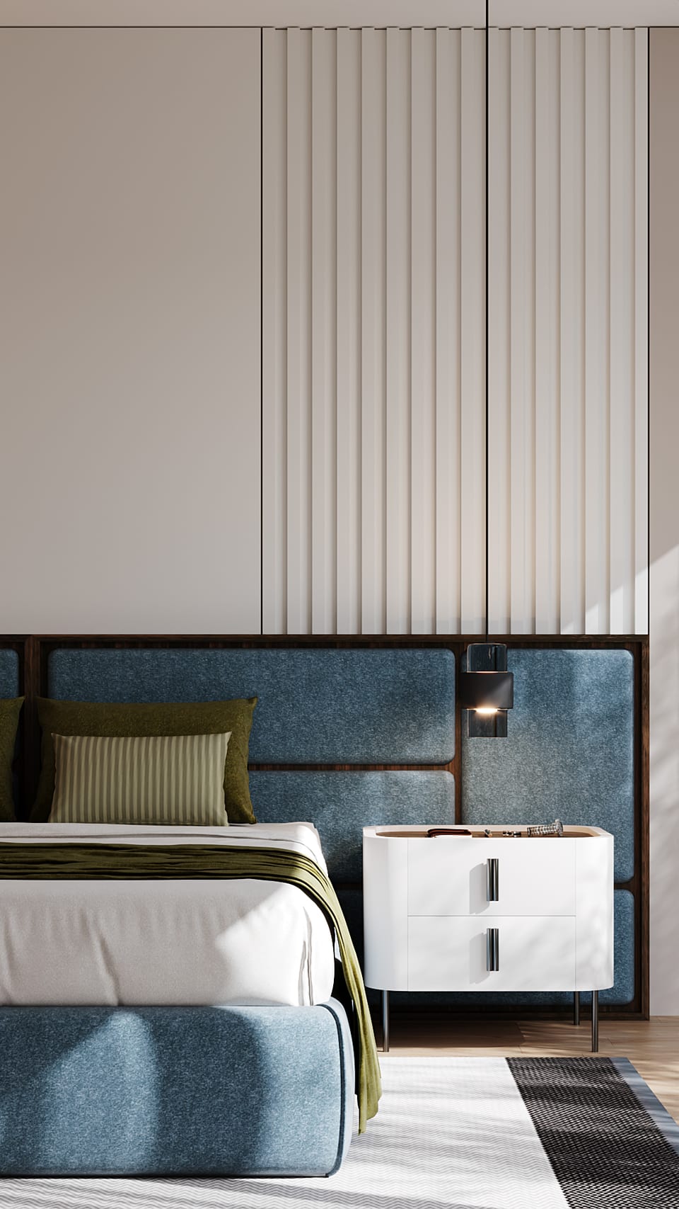 Bedroom with blue upholstered headboard, pale slatted panelling and a white two-drawer bedside table