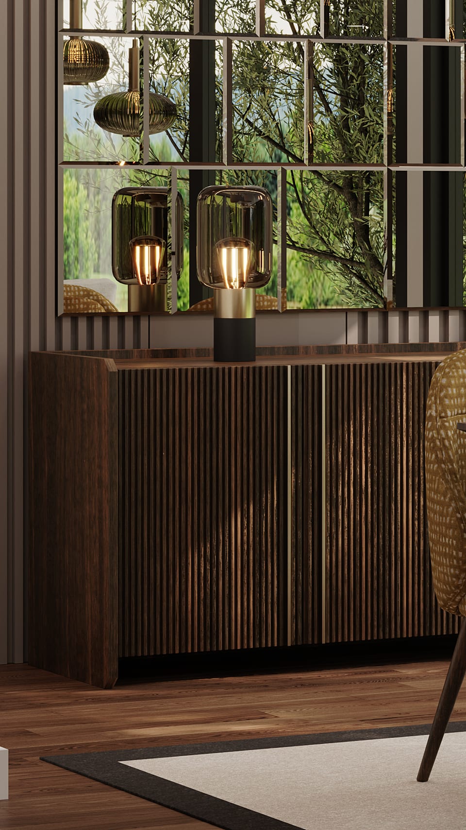 Detail of a dark fluted sideboard with a smoked glass table lamp and panelled mirror above