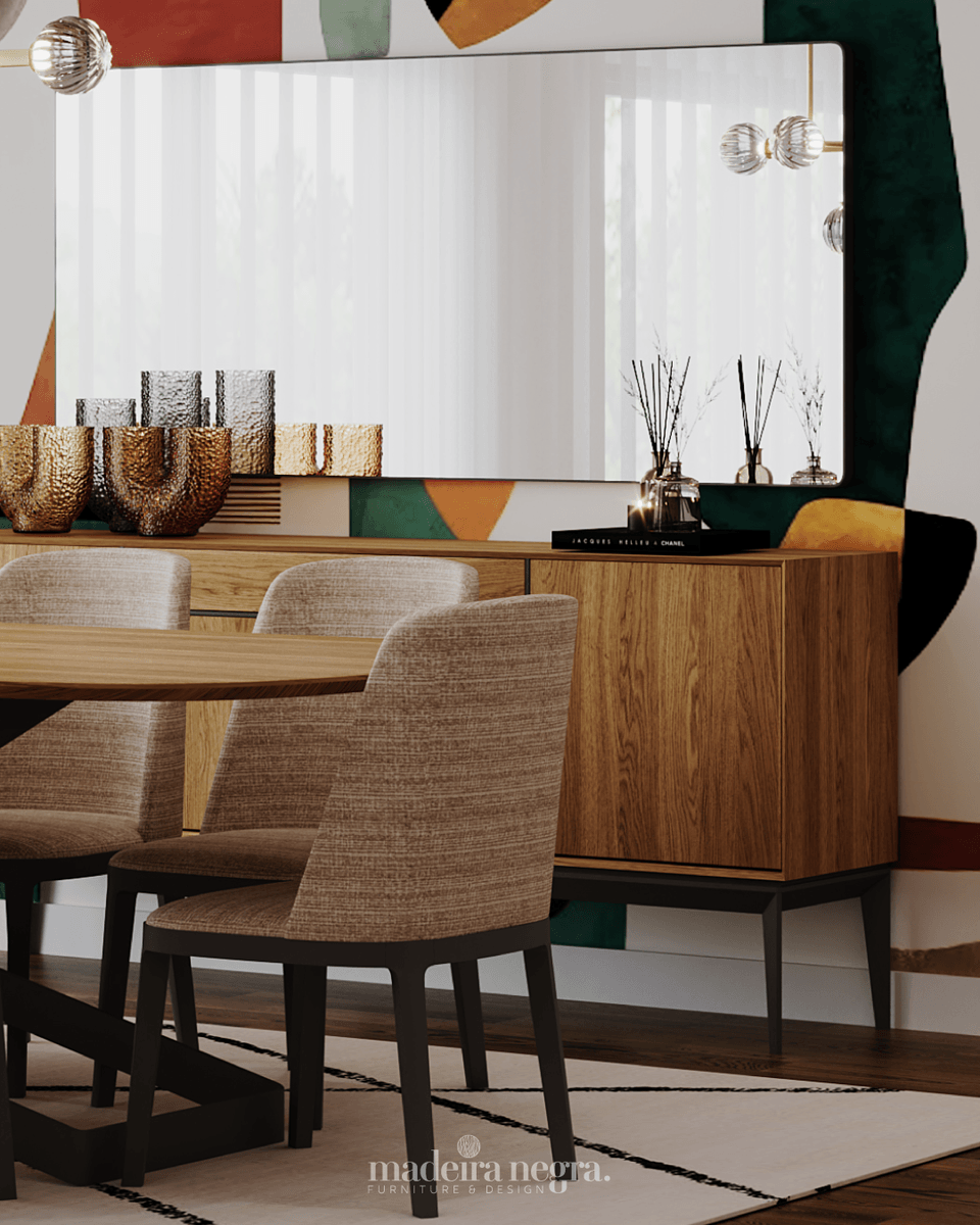 Upholstered chairs on black legs at the dining table, with a wooden sideboard and mirror behind