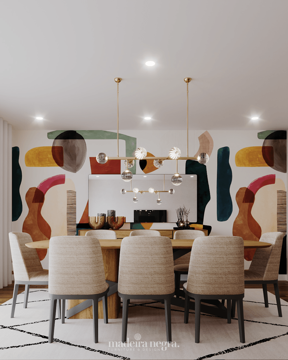 Dining room with an oval wooden table, pale chairs and a brass pendant facing the colourful mural