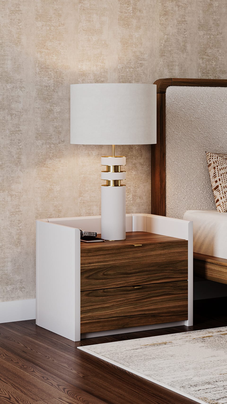 Walnut bedside table with white lacquered sides and a table lamp with white shade and gold banding